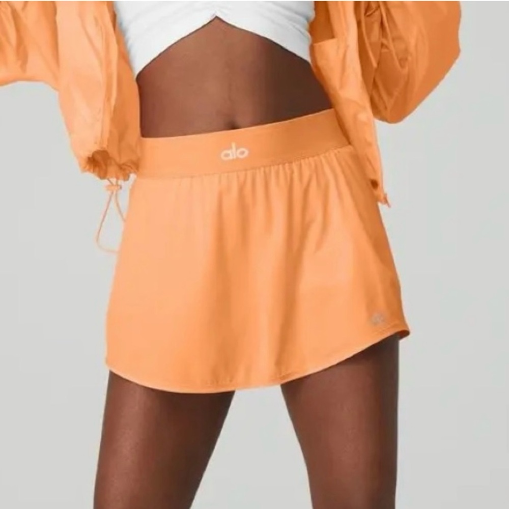 ALO Yoga orange Match Point tennis skirt, size small